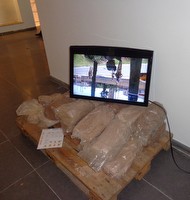 As he waits for a traffic light to turn As he waits for a traffic light to turn